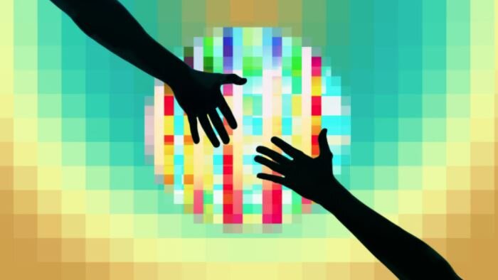 Two hands reach towards one another over a colorful pixelated background