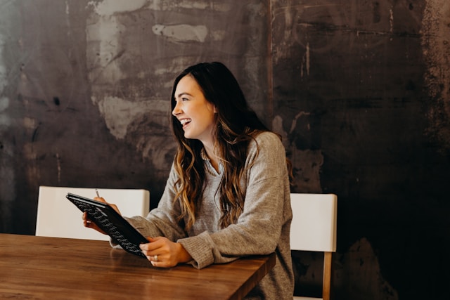 Smiling woman at a table