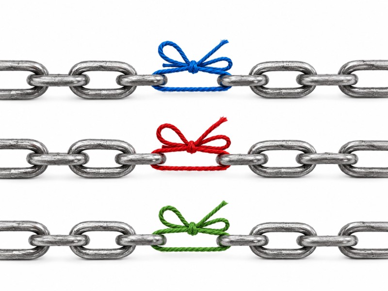 Three horizontal steel chains are displayed against a clean white background. Each chain has a gap held together with a tied piece of string instead of a metal link. The top chain uses blue string, the middle chain uses red string, and the bottom chain uses green string.